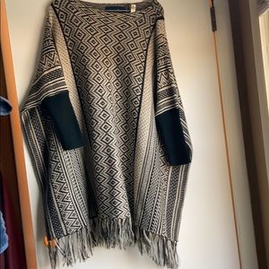 Black and cream fringe poncho.